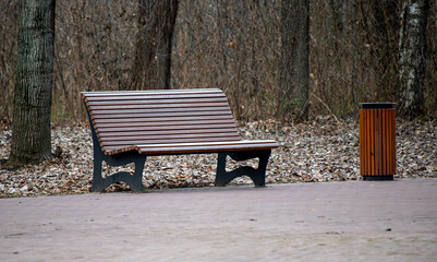 Wooden benches in the park. City park architecture.