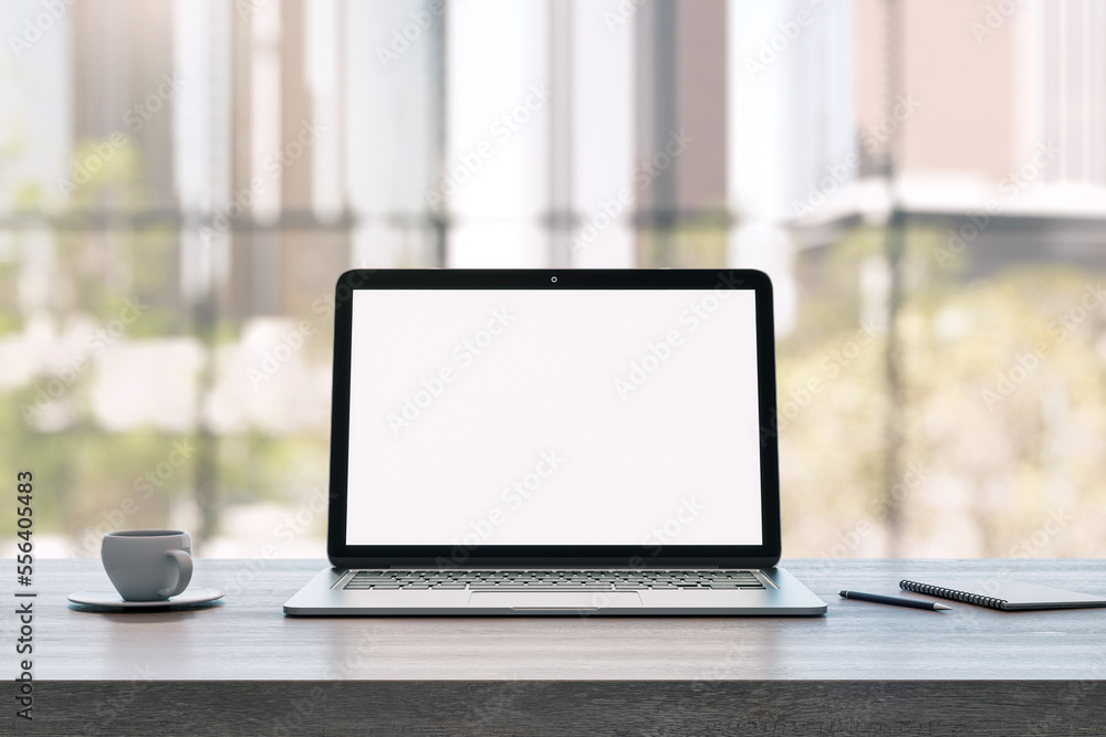 Poster front view on blank white laptop monitor screen with space for your logo or text on wooden surface o