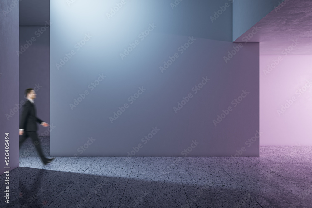 Poster side view of businessman walking in modern concrete gallery interior with mock up place on wall and 