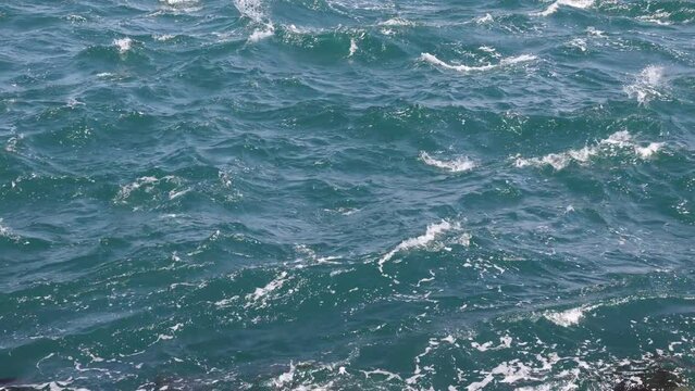 Wavy sea. Sea surface in windy day. Strong waves 4k video. Wave power concept 4k footage.
