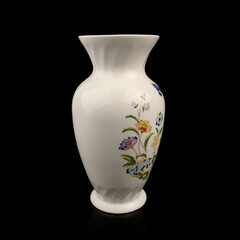 beautiful vase with a flower pattern on a black isolated background. antique porcelain vase with painting