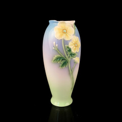 blue vase with a flower pattern on a black isolated background. antique porcelain vase with painting