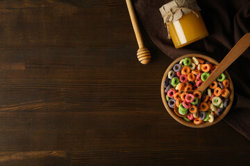 Concept of breakfast food, colorful corn flakes, space for text