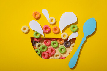 Concept of breakfast food, colorful corn flakes, top view