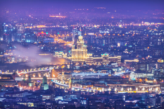 View of the city from the observation deck Panorama 360 to skyscrapers in the light of night lights and Skyscraper on Kotelnicheskaya embankment, Moscow City Federation tower, Moscow