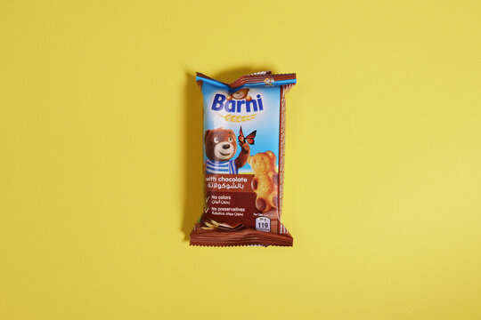 Magdalinovka, Ukraine - December 23, 2022. Barni chocolate cake biscuit bear in package on yellow background