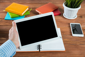 businessman with a tablet, works in the office