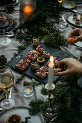 Group of friends sitting at an outdoor restaurant and having dinner. Young men and women having outdoor parties.