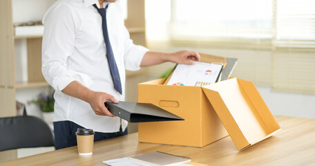 Resignation letter and cardboard box on the table, termination and resignation, job resignation....
