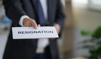 Resignation letter and cardboard box on the table, termination and resignation, job resignation....