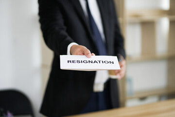 Resignation letter and cardboard box on the table, termination and resignation, job resignation....