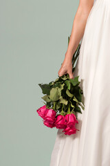 Crop bride with red roses