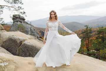 Fototapeta na wymiar Beautiful bride in white dress posing.