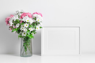 White horizontal artwork frame mockup with fresh flowers bouquet, blank mockup with copy space