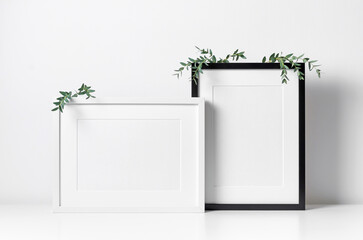 Blank frames mockup in minimalistic room interior, mockup frames template with copy space for artwork, print or photo presentation