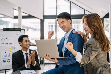Happy smiling businessman feel happy work complete Teamwork success/success at work in the office concept.