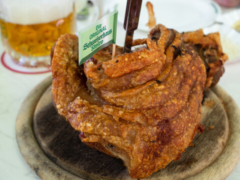 Vienna, Austria - June 4 2021: Roast Rear Knuckle of Pork at the Schweizerhaus Inn and Beer Garden in the Prater.