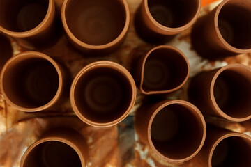 Handmade ceramic cups top view. Designer ceramic plates, bowls, cups and jugs