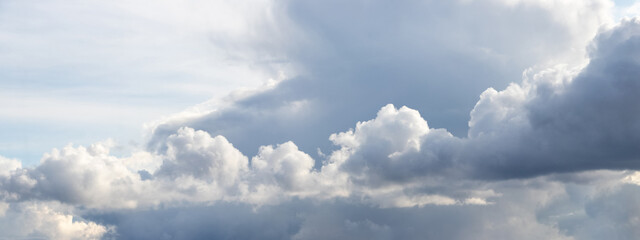 A band of curly clouds in the sky in changeable weather