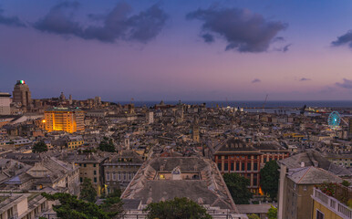 Fototapeta na wymiar Genoa old city at sunset from Spianata Castelletto in Italy.