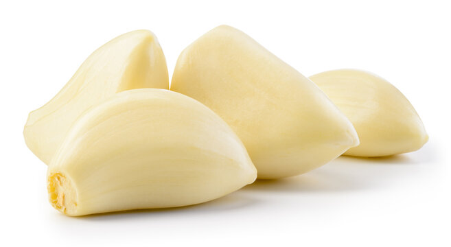 Garlic clove isolated. Garlic cloves on white background. Peeled white garlic cloves with clipping path. Full depth of field.