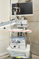 apparatus for examining and performing operations under a microscope