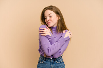 Young redhead woman cut out isolated hugs, smiling carefree and happy.