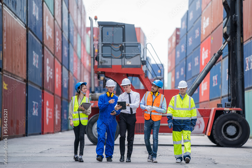 Poster Supervisor and Cargo container worker having discussion on working plan together in the container yard,Container in export and import business and logistics.
