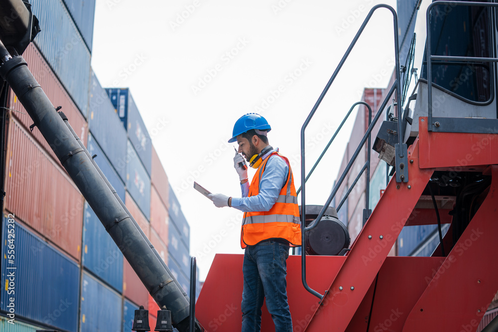Poster engineer check goods and stock in industrial container terminal,quality of product,checking on shipp
