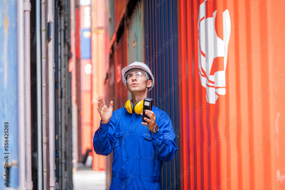 Poster Professional container yard workers checking stock for loading in the container yard warehouse,Container yard warehouse inspection,Cargo Shipping Import and Export industry.