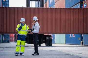 Engineer container cargo with worker working and checking stock into container for loading,logistic and business export.