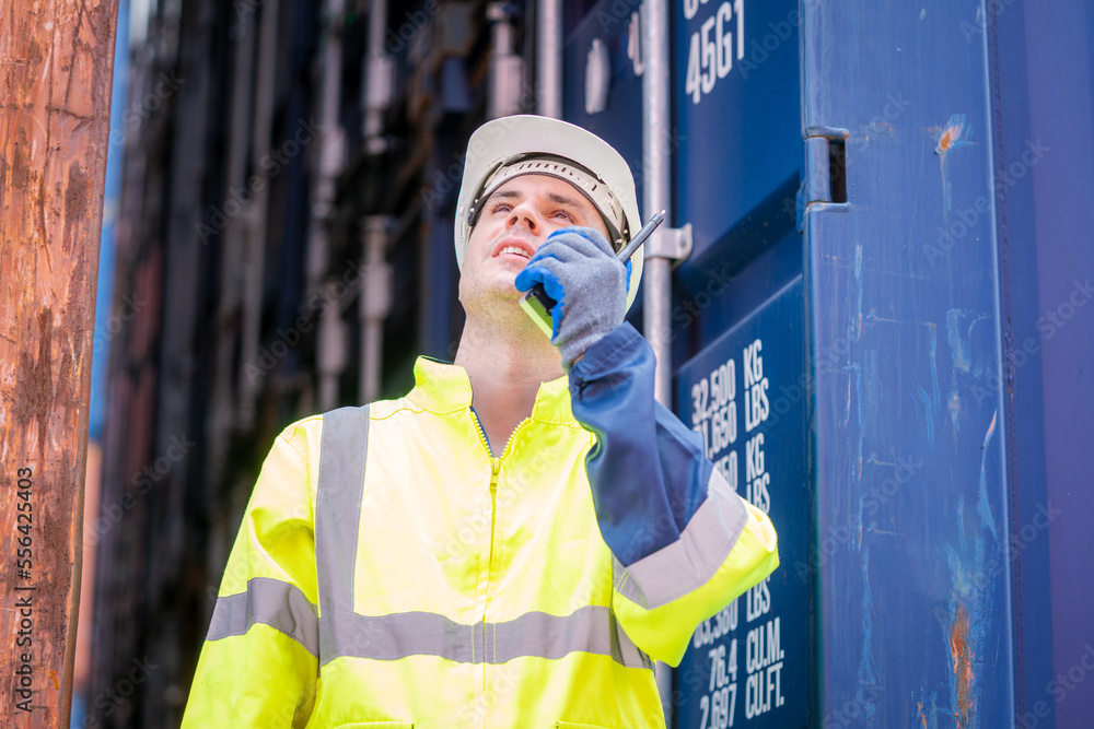 Poster Engineer container cargo working and checking stock into container for loading.logistic transport and business industry export.