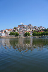 Fototapeta premium Beauty Coimbra city at Mondego river in Portugal - vertical