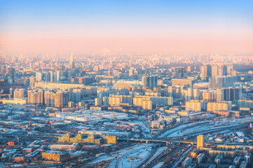 Fototapeta na wymiar View of the city from the observation deck Panorama 360 to skyscrapers in the setting sun, Federation Tower Moscow City, Moscow