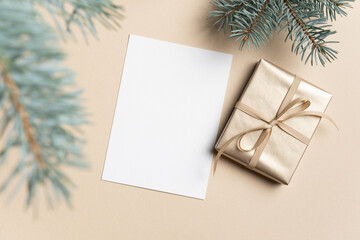 Fototapeta na wymiar Blank card mockup with gift box and christmas fir tree