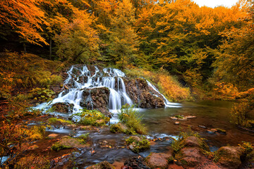 Cascade waterfalls in autumn. Travel in Bulgaria. Dokuzak waterfall