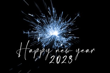 Happy new year 2023 blue sparkler new years eve countdown. Luxury entertainment celebration turn of the year party time. Premium nightlife visual with glowing light sparks on dark background - 556428402