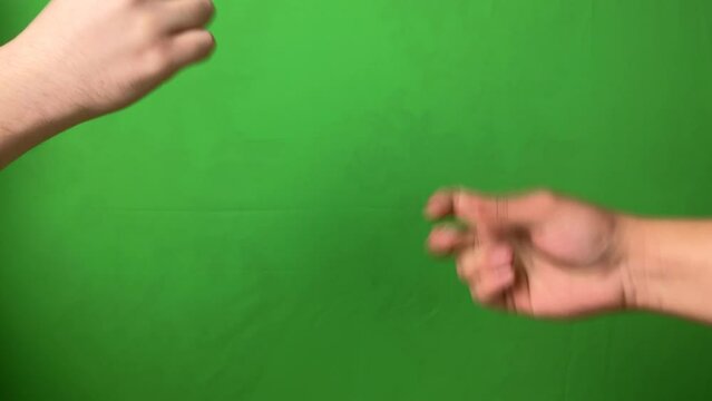 Two people play Rock Paper Scissors. Clip. Excited hand game on colored background.