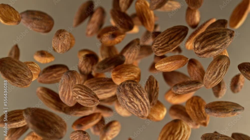 Poster super slow motion of rotating almonds up to the air. filmed on high speed cinema camera, 1000fps, pl