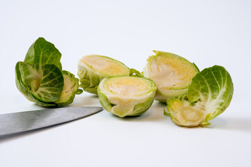selected focus Brussel sprout with knife blade isolated on a white background