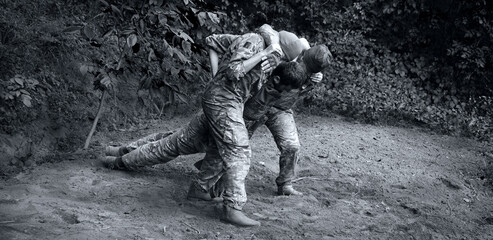 The medical workers carries a wounded soldier