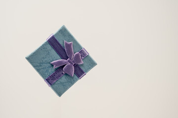 small gift box diamond layout view with ribbon and bow isolated on a white backgound
