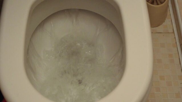 flushing the toilet. Toilet, Flushing Water. close up