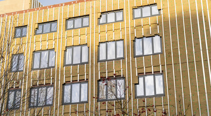 Exterior hospital wall heat insulation of facade of building with mineral wool, under construction, design of ventilated facade with metal frame