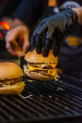 Burger with melted cheese, made on the grill

