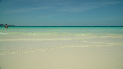 Tropical beach and turquoise water on the island of Boracay, Philippines. Summer and travel...