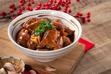Taiwanese traditional food pork knuckle in a bowl for Chinese Lunar New Year meal.