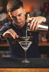 Man bartender at work