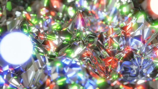 A metallic, shiny surface above which three glowing spheres in different colors float and everything spins. In 4k and 60fps (high frame rate).
