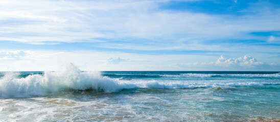 Beautiful tropical sea and sun on blue sky background. Wide photo.